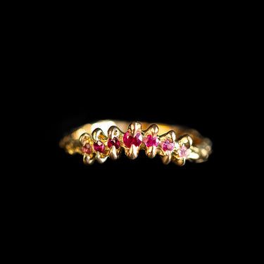 Tiny curved pink claw ring