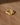 Organic diamond contour ring with sculptural claw details in textured gold