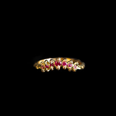 Tiny curved pink claw ring